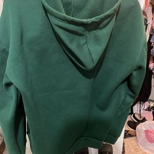 Green zip up with a heart design size L 8/10 worn once